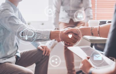 business people shaking hands and computer